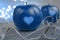 Two red apples with a heart seal on the table. Orange heart on organically grown fruits. Growing fruits with prints. classic blue