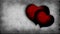 Two red beating hearts on a old-movie effect background