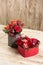 Two red boxes with flowers and gingerbread hearts