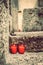 Two red candles on a grave. Lanterns on a tombstone at All Saints` Day in a cemetery. Shallow depth of field. Religion, funeral,