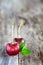 Two Red cherry on a old wooden background, vertical composition - Image