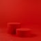 Two red cylinder podiums mockup on table on rich saturated background for presentation cosmetic products, gifts, goods in minimal.