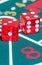 Two red dice on green gambling game