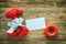 Two red dumbbell with gift bow, paper tag, carpal expander
