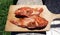 Two Red fishes on a wooden kitchen cutting board, prepared to cook