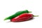 Two red and green hot chili peppers on a white background. Spices for food. Bright juicy colors