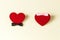 Two red hearts as symbols heterosexual couple in love