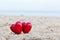 Two red hearts on the beach. Love