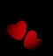 Two red hearts on a dark background, soft focus. Romantic card.