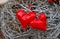 Two red hearts made of patent leather