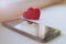 Two red hearts and a mobile phone on a white background. The concept of love. Valentine`s Day
