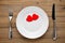 Two red hearts on plate