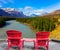 Two red loungers by the Abraham lake