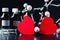 Two red paper hearts and molecular structure model on a black background. Love chemistry concept