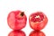 Two red ripe pomegranates whole and cutted on white background isolated close up