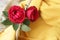 Two red roses decoration on yellow background. Rose flower. floral backgrounds with copy space for your text message or design.