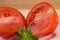 Two red sliced tomates close