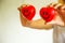 Two Red Smiling Hearts held by female nurse`s hands, representing giving effort high quality service mind to patient. Profession