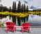 Two red sun loungers on the lake