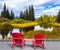 Two red sun loungers for tourists