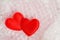 Two red valentine hearts are packed in a transparent bubble wrap. The concept of love, Valentine Day, the fragility of love.