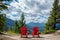 Two red wooden chairs on Tunnel Moutain with a view on Banff, Rocky Mountains, Alberta Canada