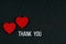 two red wooden hearts and thank you phrase