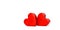 Two red wooden hearts on a white background