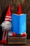 Two red woolen gnome busy with  notebook, cute Christmas ornament for winter time decoration