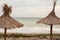 Two reed roof on a beach at Black Sea