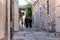 Two religious Jews walk and talk down the street near Jaffa Gate in the old city of Jerusalem, Israel