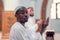 Two religious muslim man praying together inside the mosque