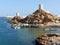 Two restored watchtowers and a lighthouse in Sur, Oman