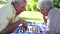 Two retired people playing chess