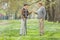 Two retired seniors talking in park