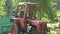 Two retro agriculture tractors in old farm and sunlight. 4K