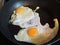 Two rganic free range eggs cooked sunny side up in a non-stick high quality pan