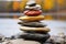 two rings balanced on a stacked stone cairn