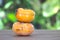 Two ripe soft persimmons on the table