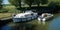 Two river power boats at Godmanchester lock on the river Ouse.