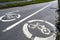 Two road signs `Bicycle path` on asphalt