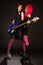 Two rock girls with bass guitar