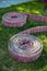 Two rolled fire hoses on grass