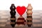 Two romantic chessmans on marble chess-board