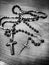 Two rosaries. Artistic look in black and white.