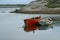 Two rowboats anchored in the cove of a fishing village in Nova Scotia.