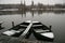 Two rowing boats covered with snow in winter lake