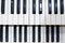 Two rows of black and white keys of an old musical instrument, an organ