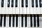 Two rows of black and white keys of an old musical instrument, an organ