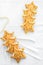 Two rows decorative golden stars handmade from dough